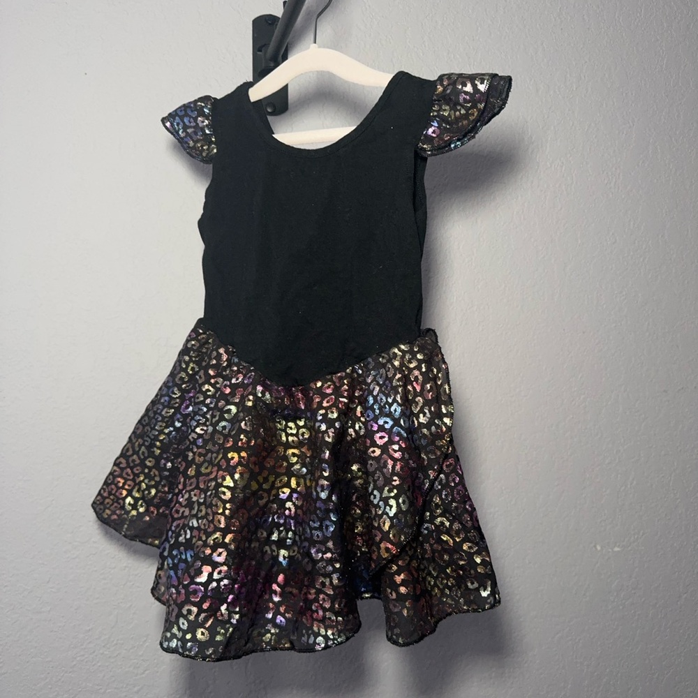 Black Dance Costume with Ruffled Sleeves and Sequined Skirt